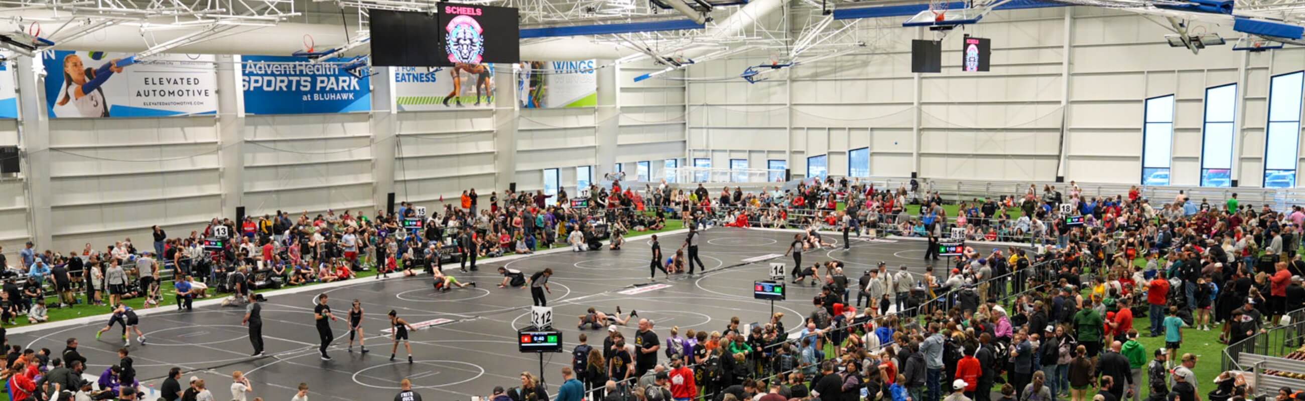 Indoor sports complex hosting a youth wrestling tournament